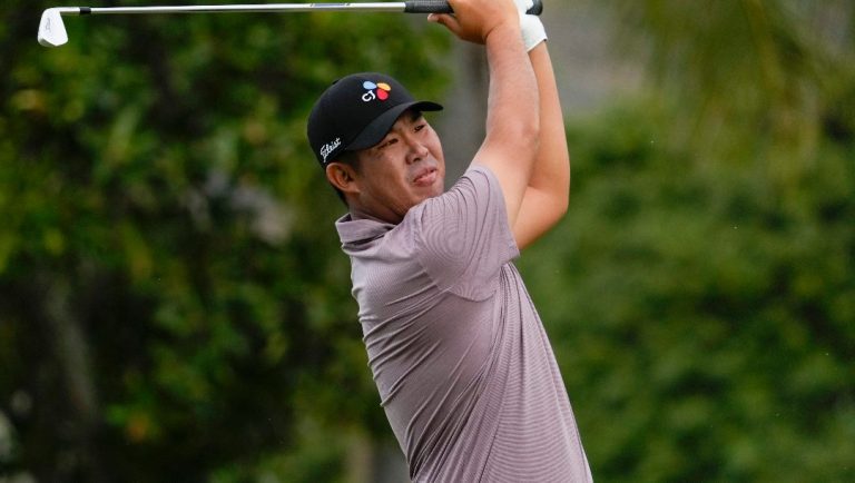 Byeong Hun An, of South Korea, hits from the 11th tee during the first round of the Sony Open golf event, Thursday, Jan. 9, 2025, at Waialae Country Club in Honolulu.