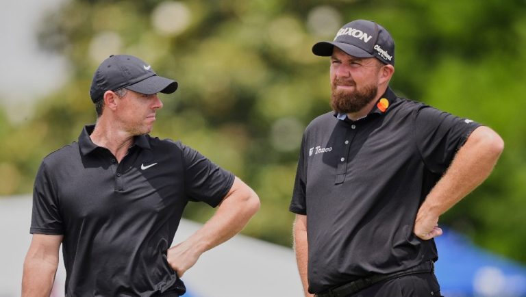 Rory McIlroy, of North Ireland, left, and teammate Shane Lowry, of Ireland, stand on the 9th green during the first round of the PGA Zurich Classic golf tournament at TPC Louisiana in Avondale, La., Thursday, April 24, 2025.