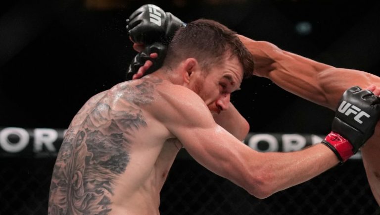 Russia's Umar Nurmagomedov, right, fights with Cory Sandhagen, left, of the United States, during a bantamweight mixed martial arts.