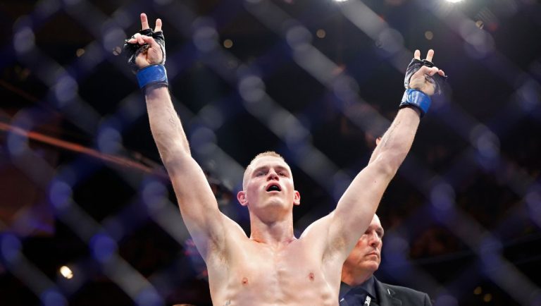 Ian Garry celebrates a win against Neil Magny during a UFC 292 mixed martial arts fight, Saturday, August 19, 2023, in Boston.