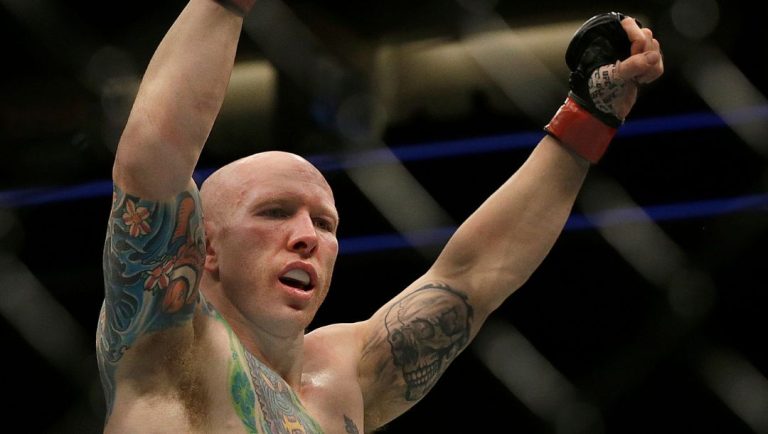Josh Emmett reacts after beating Scott Holtzman in a UFC Fight Night mixed martial arts fight in Sacramento, Calif., Saturday.