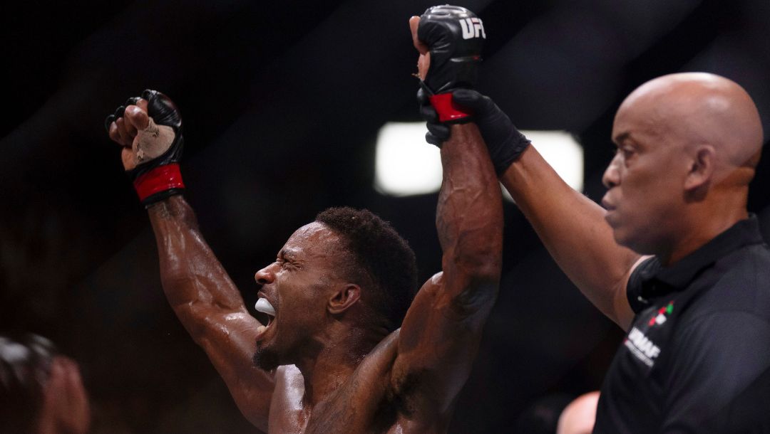 Lerone Murphy, left, celebrates after defeating Dan Ige in a featherweight mixed martial arts bout at UFC Fight Night on Saturday.