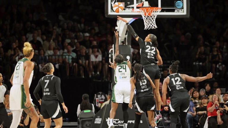 Las Vegas Aces center A'ja Wilson (22) jumps to block Seattle Storm guard Jewell Loyd (24) during a first-round WNBA basketball playoff game Sunday, Sept. 22, 2024, in Las Vegas.