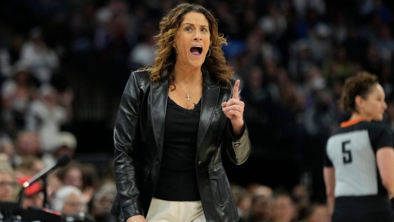 Connecticut Sun head coach Stephanie White reacts after a foul called on the Sun during the first half of Game 5 of a WNBA basketball semifinals against the Minnesota Lynx, Tuesday, Oct. 8, 2024, in Minneapolis.