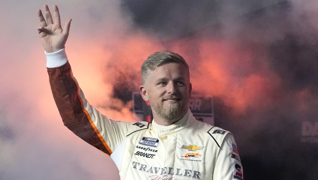 Justin Allgaier waves during driver introductions before two NASCAR Daytona 500 qualifying auto races at Daytona International Speedway, Thursday, Feb. 13, 2025, in Daytona Beach, Fla. (AP Photo/John Raoux)
