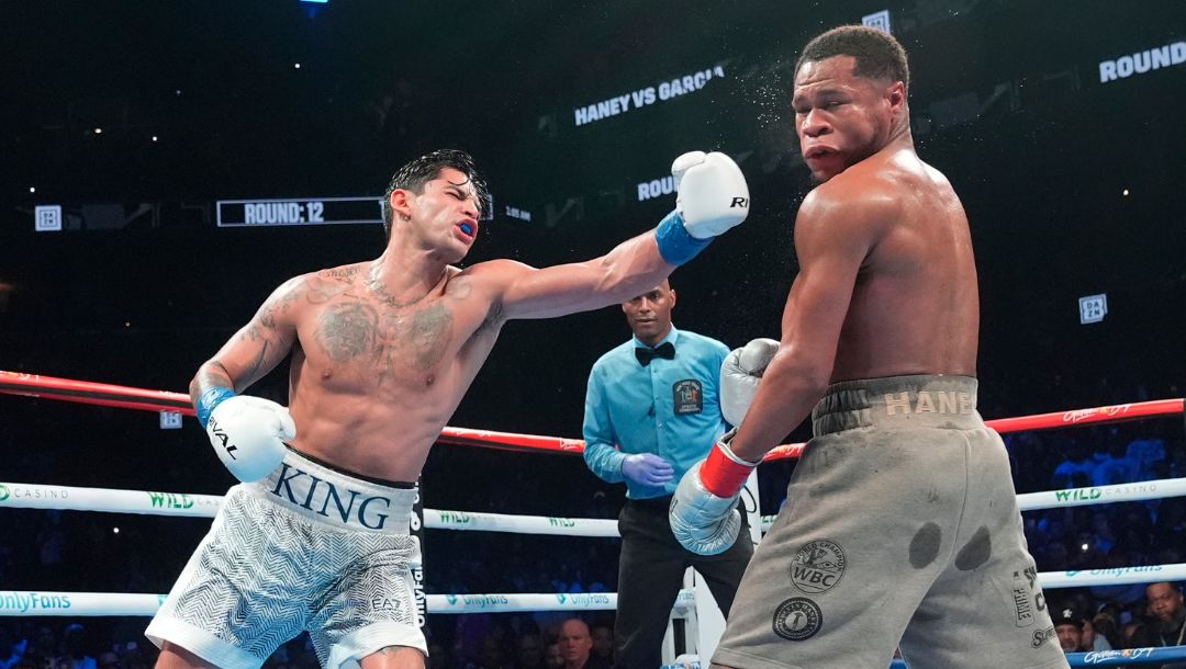 Ryan Garcia, left, punches Devin Haney during the 12th round of a super lightweight boxing match Sunday, April 21, 2024.