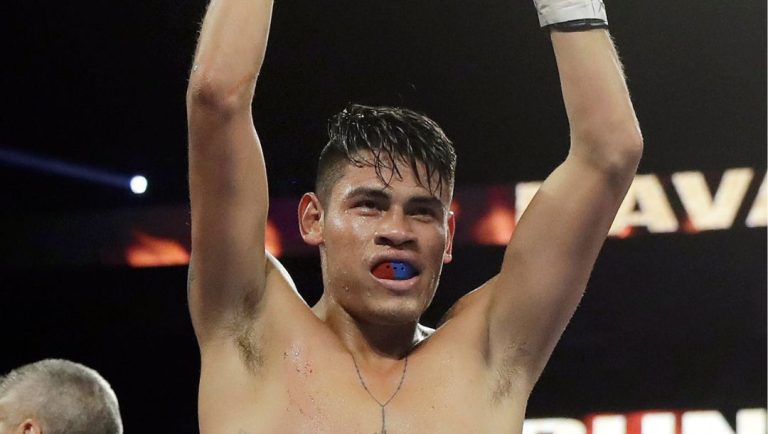 Emanuel Navarrete, right, of Mexico. celebrates after defeating Juan Miguel Elorde, of the Philippines, during their boxing match.