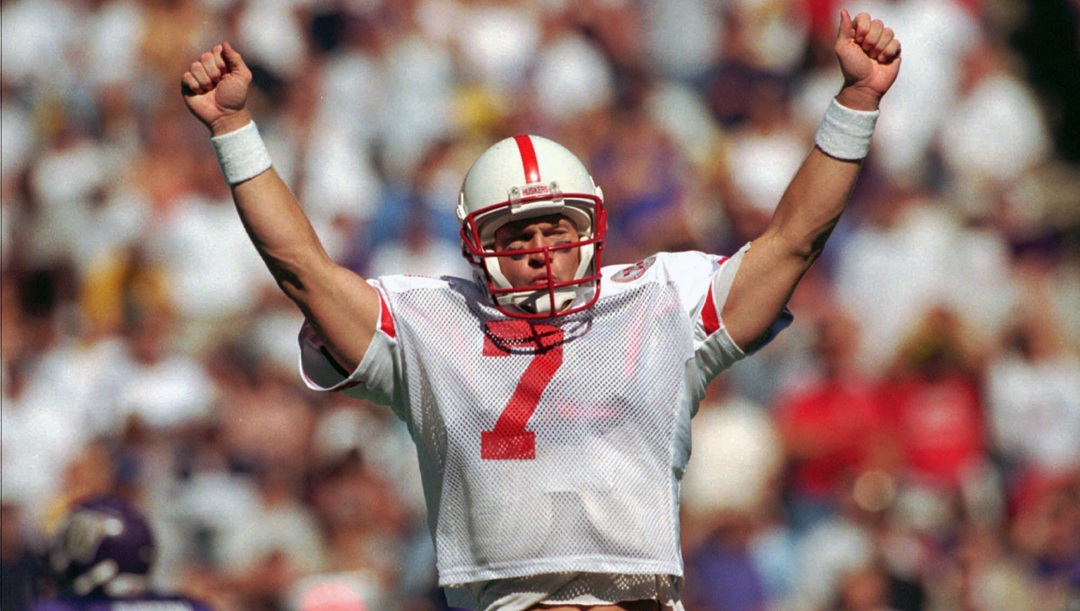 In this Sept. 20, 1997, file photo, Nebraska quarterback Scott Frost turns to Huskers' fans to signal his team's third, first-half touchdown against the Washington Huskies, in Seattle. Scott Frost’s first game as Nebraska's head coach is here. That Akron is the opponent is a footnote. A Saturday night Big Red Rival is going to be held at Memorial Stadium, where a sellout crowd will celebrate the return of a homegrown Husker and quarterback of the undefeated 1997 co-national championship team.