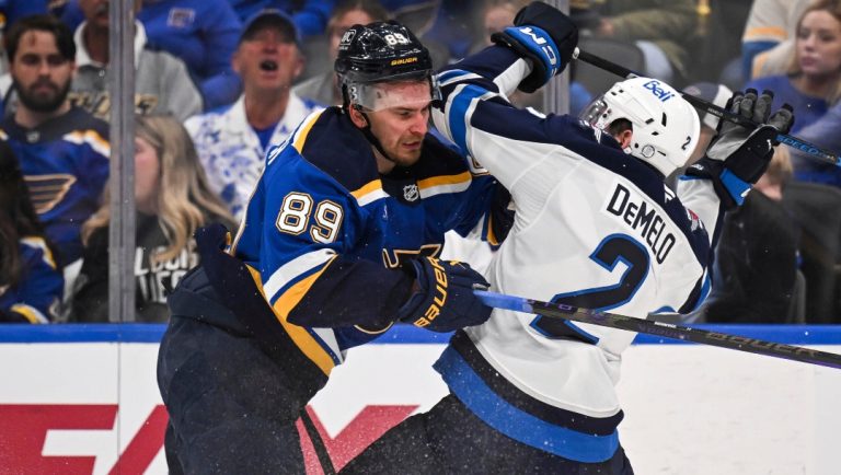 St. Louis Blues' Pavel Buchnevich (89) checks Winnipeg Jets' Dylan DeMelo (2) during the second period in Game 4 of an NHL hockey first-round playoff series Sunday, April 27, 2025, in St. Louis. (AP Photo/Connor Hamilton)