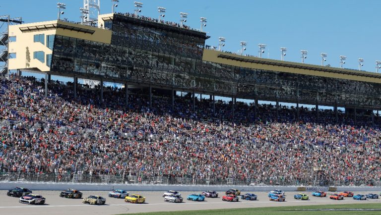 Drivers head toward Turn 1 during the start of a NASCAR Cup Series auto race at Kansas Speedway in Kansas City, Kan., Sunday, Sept. 29, 2024. (AP Photo/Colin E. Braley)