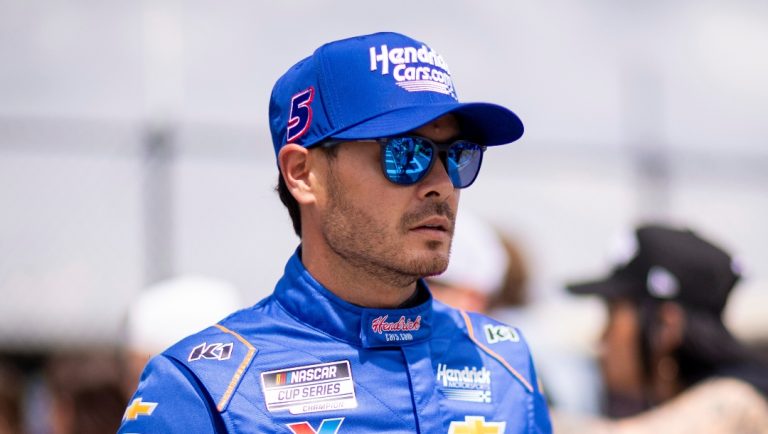 Driver Kyle Larson heads to the track before a NASCAR Cup Series auto race at Darlington Raceway, Sunday, April 6, 2025, in Darlington, S.C. (AP Photo/Scott Kinser)