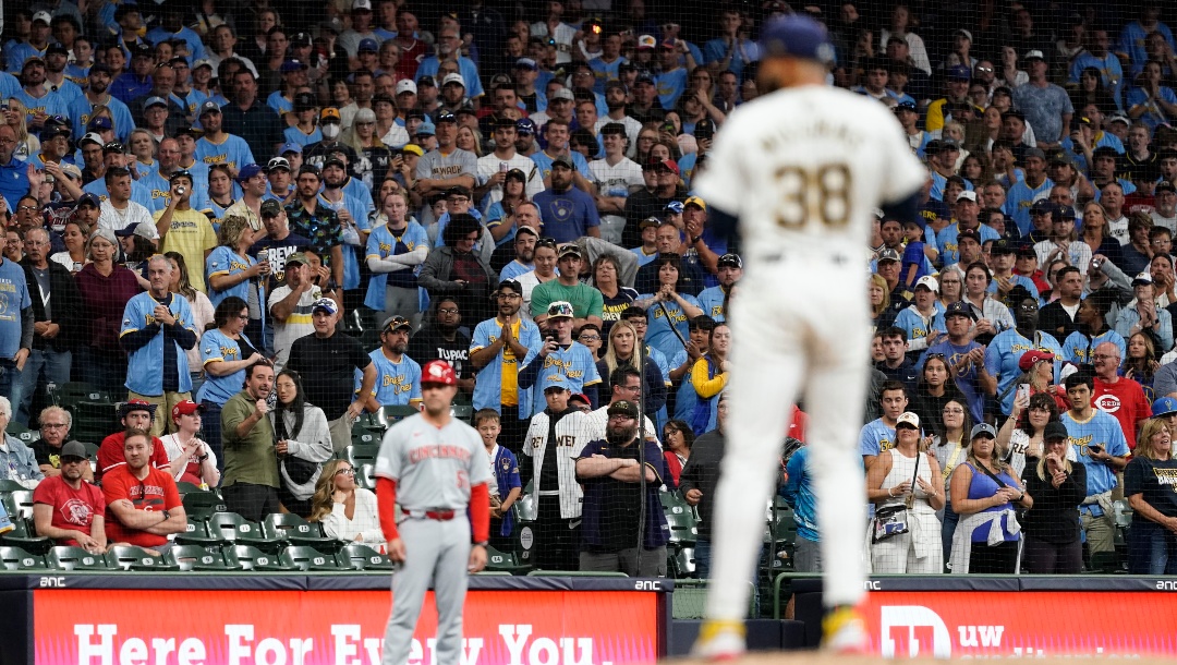 Fans watch as Milwaukee Brewers' Devin Williams pitches during the ninth inning of a baseball game against the Cincinnati Reds, Saturday, Aug. 10, 2024, in Milwaukee.