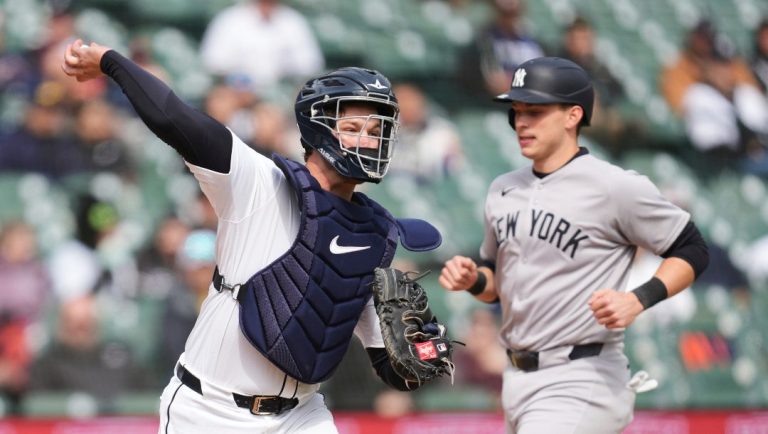 Detroit Tigers catcher Dillon Dingler throws from home plate to first base to complete a double play as New York Yankees' Ben Rice runs in the ninth inning during a baseball game, Wednesday, April 9, 2025, in Detroit.