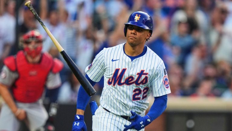 New York Mets' Juan Soto (22) tosses his bat as he runs the bases after hitting a two-run home run during the third inning of a baseball game against the Washington Nationals Wednesday, June 11, 2025, in New York.