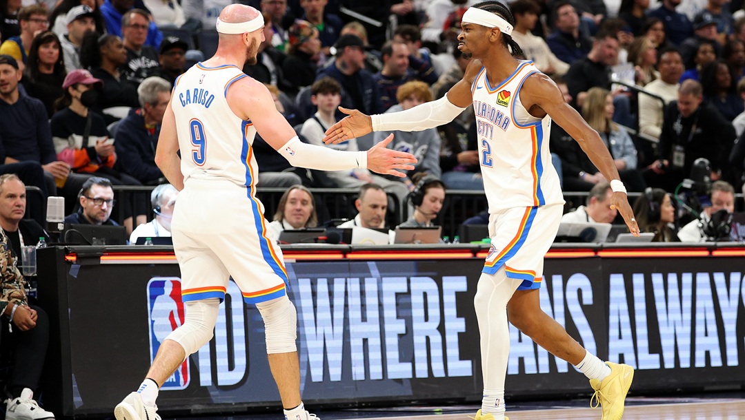MINNEAPOLIS, MINNESOTA - FEBRUARY 23: Alex Caruso #9 and Shai Gilgeous-Alexander #2 of the Oklahoma City Thunder celebrate against the Minnesota Timberwolves in the third quarter at Target Center on February 23, 2025 in Minneapolis, Minnesota. The Thunder defeated the Timberwolves 130-123.