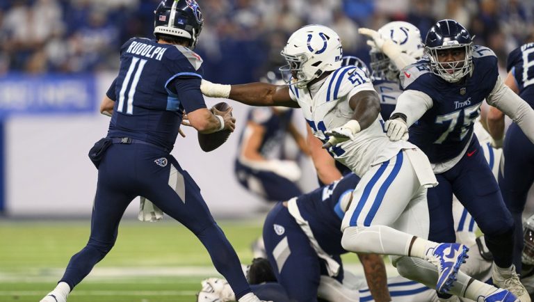 Indianapolis Colts defensive end Kwity Paye (51) sacks Tennessee Titans quarterback Mason Rudolph (11) during an NFL football game, Sunday, Dec. 22, 2024, in Indianapolis. The Colts defeated the Titans 38-30.