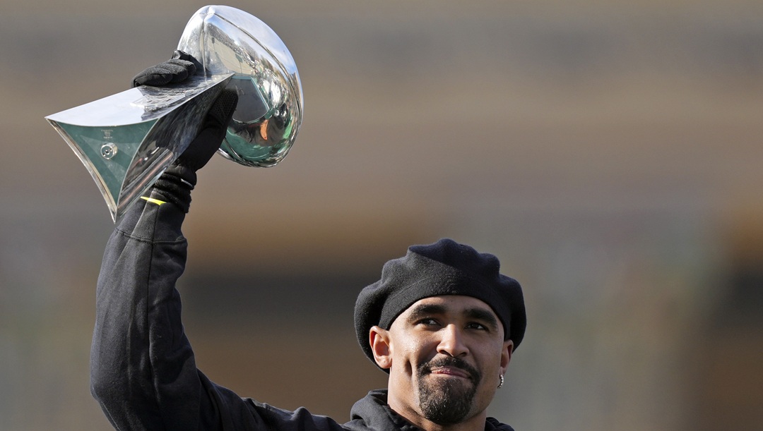 Philadelphia Eagles quarterback Jalen Hurts holds up the Lombardi trophy as he speaks during the team's NFL football Super Bowl 59 parade and celebration, Friday, Feb. 14, 2025, in Philadelphia.