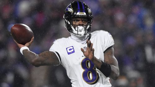 Baltimore Ravens quarterback Lamar Jackson (8) passes against the Buffalo Bills during the first quarter of an NFL divisional playoff football game, Sunday, Jan. 19, 2025, in Orchard Park, N.Y.