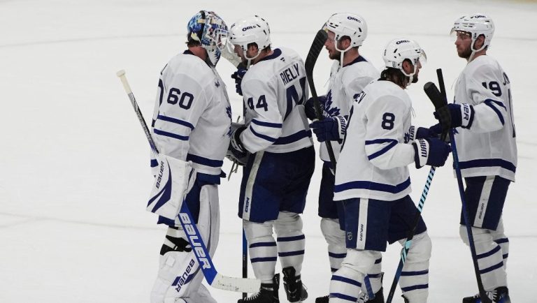 Toronto Maple Leafs goaltender Joseph Woll (60) is congratulated by his teammates after winning Game 6 of a second-round NHL hockey playoff series against the Florida Panthers, Friday, May 16, 2025, in Sunrise, Fla.