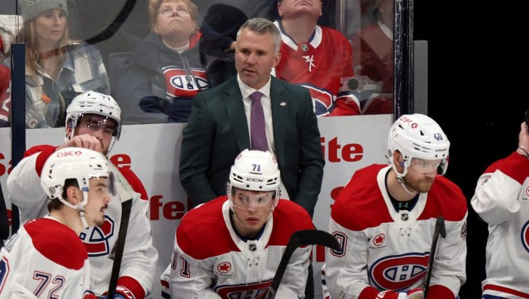 Montreal Canadiens coach Martin St. Louis, center top, watches his team during the third period of an NHL hockey game against the Columbus Blue Jackets in Columbus, Ohio, Monday, Dec. 23, 2024.