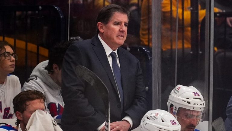 New York Rangers head coach Peter Laviolette looks onto the ice during the second period of an NHL hockey game against the Nashville Predators, Tuesday, Dec. 17, 2024, in Nashville, Tenn.