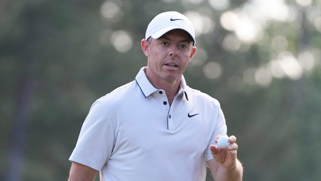 Rory McIlroy, of Northern Ireland, waves after making a putt on the 14th hole during the third round at the Masters golf tournament, Saturday, April 12, 2025, in Augusta, Ga.