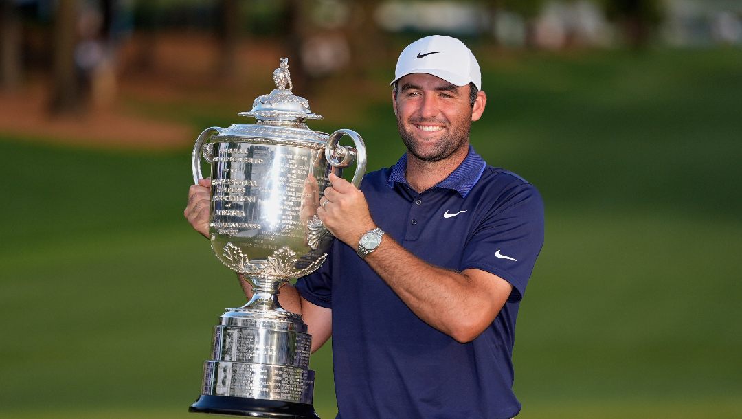 Scottie Scheffler holds the Wanamaker trophy after winning the PGA Championship golf tournament at the Quail Hollow Club, Sunday, May 18, 2025, in Charlotte, N.C.