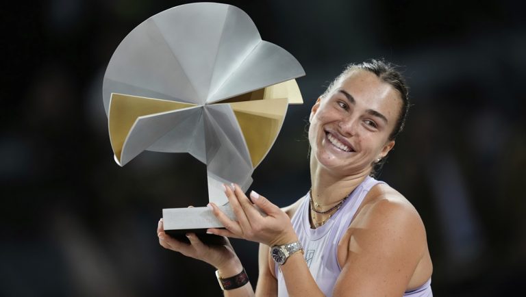 Aryna Sabalenka of Belarus holds a trophy after winning the Madrid Open tennis final in Madrid, Spain, Saturday, May 3, 2025.