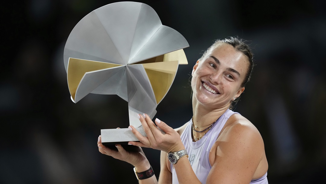 Aryna Sabalenka of Belarus holds a trophy after winning the Madrid Open tennis final in Madrid, Spain, Saturday, May 3, 2025.