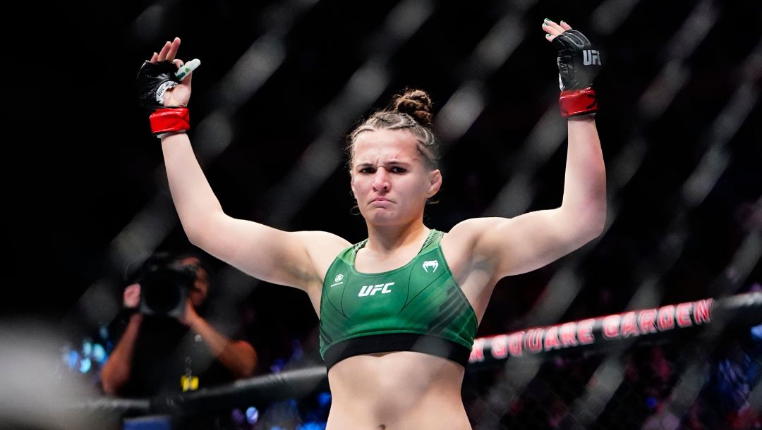Erin Blanchfield celebrates after defeating Molly McCann, of England, in a women's flyweight bout at the UFC 281.