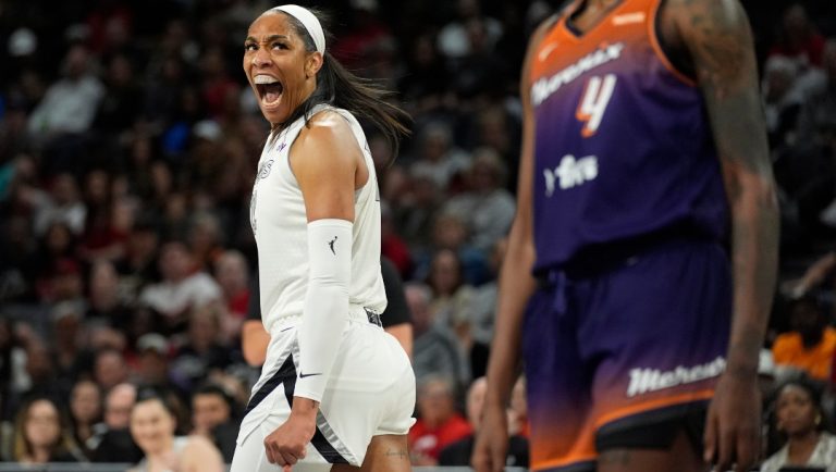 Las Vegas Aces center A'ja Wilson (22) celebrates after scoring against the Phoenix Mercury during the first half of a WNBA basketball game Tuesday, May 14, 2024, in Las Vegas.
