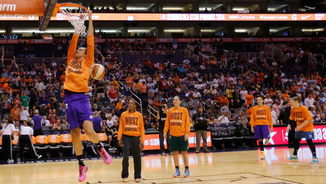 West's Brittney Griner, of the Phoenix Mercury, dunks during warm up's prior to the WNBA All-Star basketball game, Saturday, July 19, 2014, in Phoenix.