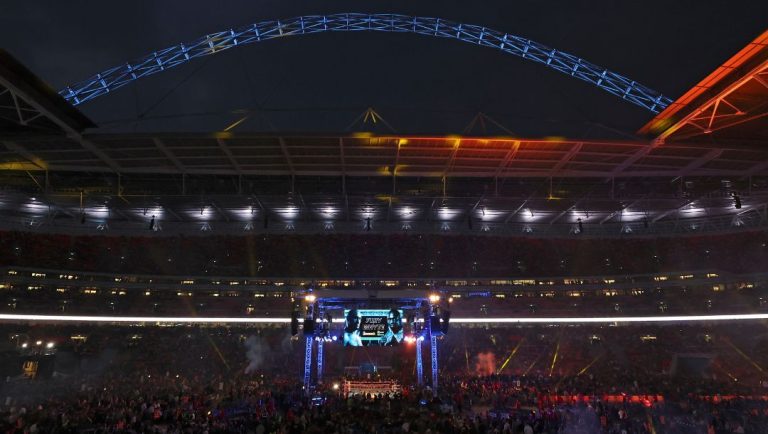 Spectators gather as Britain's Tyson Fury and Britain's Dillian Whyte prepare to enter the ring for a WBC heavyweight title.