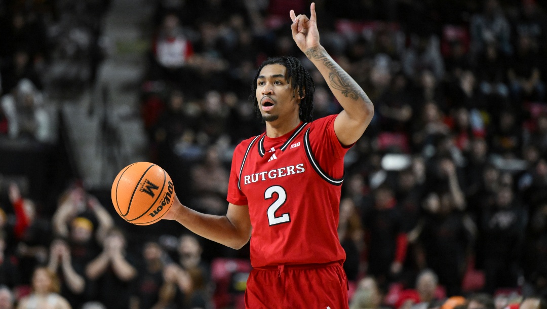 Rutgers guard Dylan Harper (2) handles the ball during the first half of an NCAA college basketball game against Maryland, Sunday, Feb. 9, 2025, in College Park, Md.