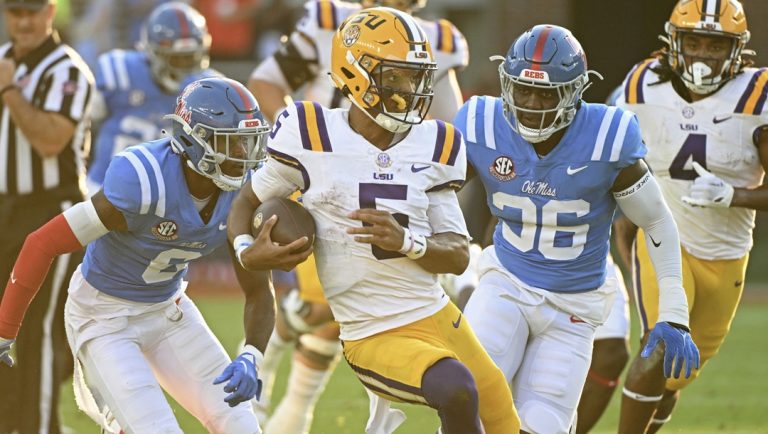 LSU quarterback Jayden Daniels (5) runs the ball during the first half of an NCAA college football game against Mississippi in Oxford, Miss., Saturday, Sept. 30, 2023.