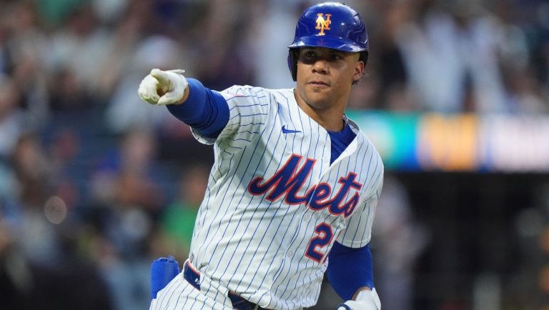 New York Mets' Juan Soto gestures to teammates as he runs the bases after hitting a home run during the fourth inning of a baseball game against the Atlanta Braves Wednesday, June 25, 2025, in New York.