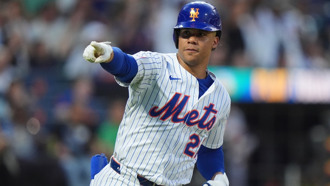 New York Mets' Juan Soto gestures to teammates as he runs the bases after hitting a home run during the fourth inning of a baseball game against the Atlanta Braves Wednesday, June 25, 2025, in New York.
