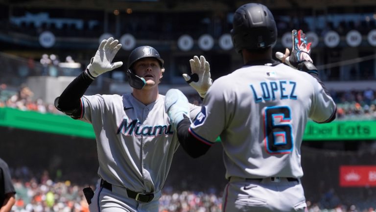 Miami Marlins' Kyle Stowers, left, celebrates after hitting a three-run home run that also scored shortstop Otto Lopez (6) and Agustín Ramírez during the first inning of a baseball game against the San Francisco Giants in San Francisco, Thursday, June 26, 2025.