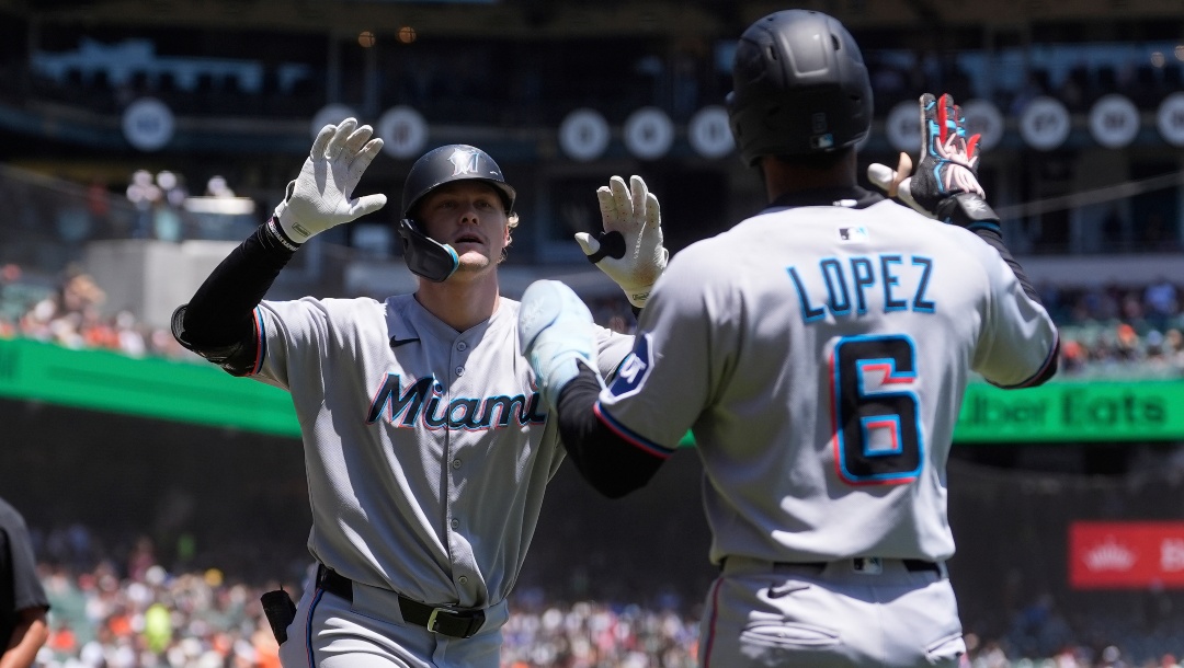 Miami Marlins' Kyle Stowers, left, celebrates after hitting a three-run home run that also scored shortstop Otto Lopez (6) and Agustín Ramírez during the first inning of a baseball game against the San Francisco Giants in San Francisco, Thursday, June 26, 2025.
