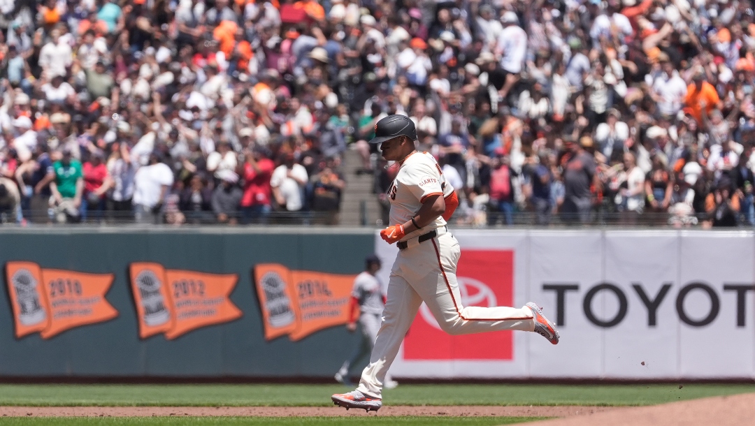 San Francisco Giants' Rafael Devers hits a two-run home run during a baseball game against the Boston Red Sox in San Francisco, Saturday, June 21, 2025.