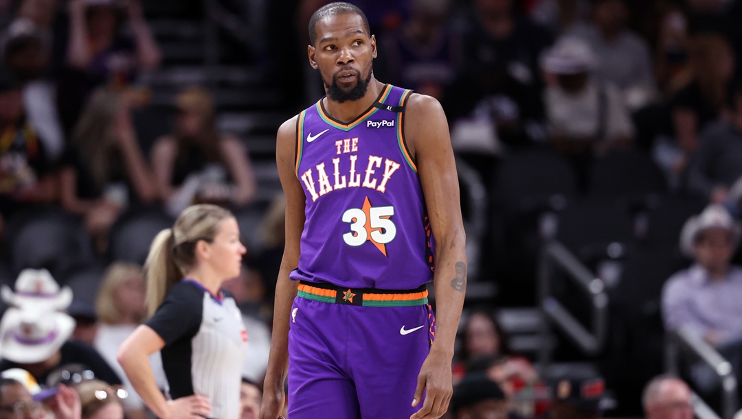 PHOENIX, ARIZONA - MARCH 30: Kevin Durant #35 of the Phoenix Suns looks on during the second half against the Houston Rockets at PHX Arena on March 30, 2025 in Phoenix, Arizona. The Rockets defeated the Suns 148-109.