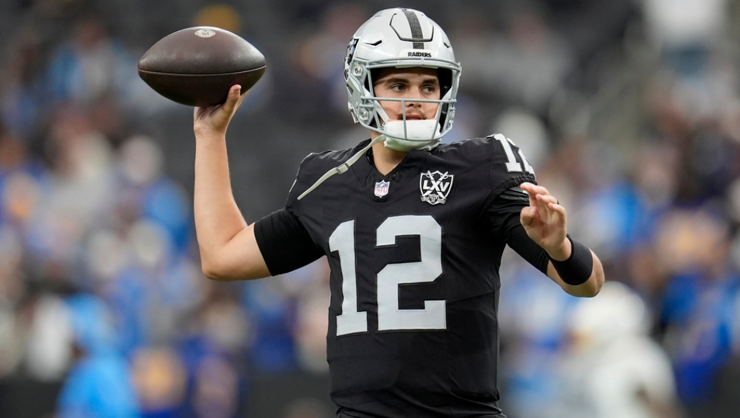 Las Vegas Raiders quarterback Aidan O'Connell warms up before an NFL football game against the Los Angeles Chargers in Las Vegas, Sunday, Jan. 5, 2025.