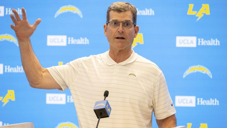 Los Angeles Chargers head coach Jim Harbaugh answers questions during the NFL football team's rookie camp Friday, May 9, 2025, in El Segundo, Calif.