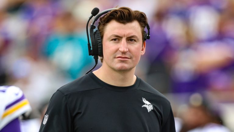FILE - Minnesota Vikings assistant offensive coordinator/assistant quarterbacks coach Grant Udinski walks the sideline before an NFL football game against the Jacksonville Jaguars, Nov. 10, 2024, in Jacksonville, Fla.