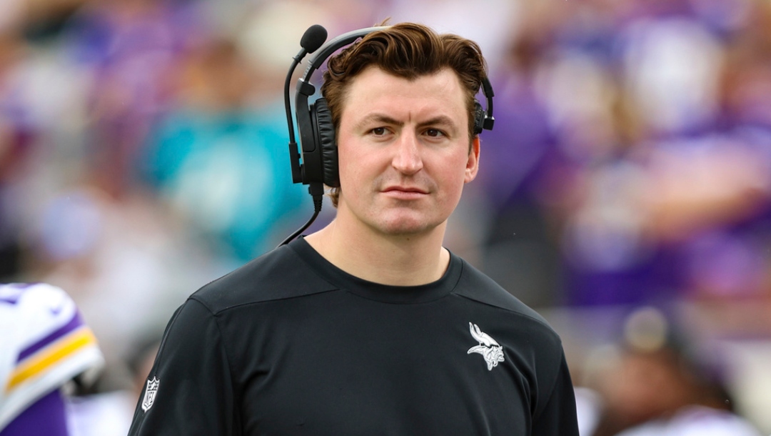 FILE - Minnesota Vikings assistant offensive coordinator/assistant quarterbacks coach Grant Udinski walks the sideline before an NFL football game against the Jacksonville Jaguars, Nov. 10, 2024, in Jacksonville, Fla.