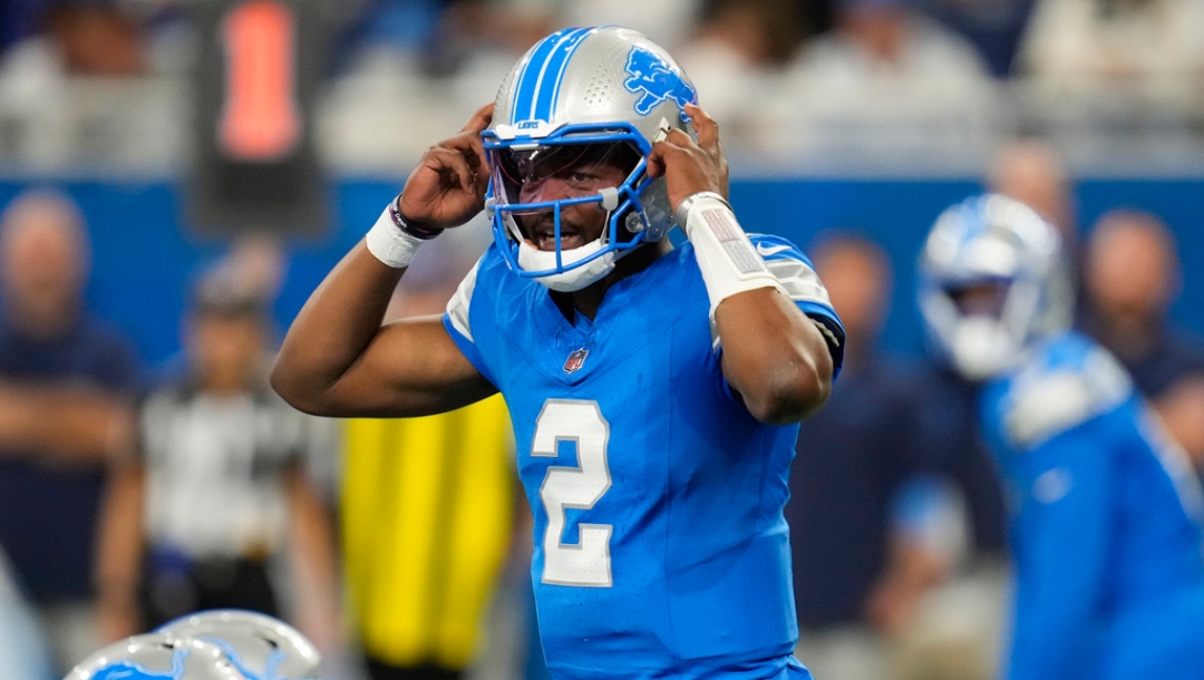Detroit Lions quarterback Hendon Hooker (2) signals at the line of scrimmage against the Tennessee Titans during an NFL football game, Oct. 27, 2024, in Detroit.