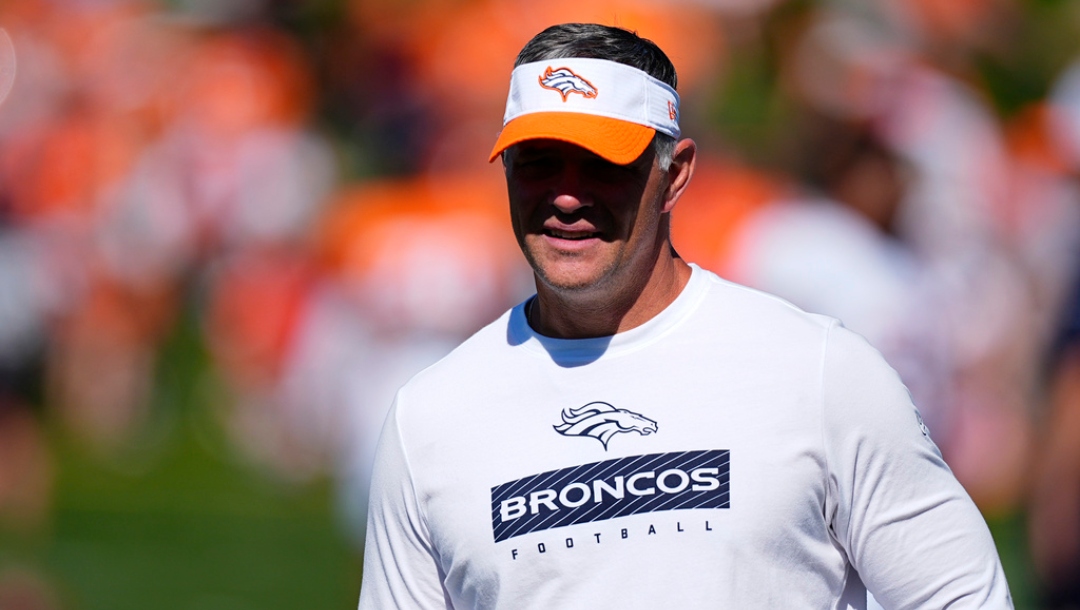 Denver Broncos offensive coordinator Joe Lombardi takes part in drills during an NFL football training camp Monday, July 29, 2024, at the team's headquarters in Centennial, Colo.