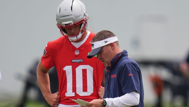 New England Patriots offensive coordinator Josh McDaniels, right, talks with quarterback Drake Maye (10) during an NFL football practice, Wednesday, May 28, 2025, in Foxborough, Mass.