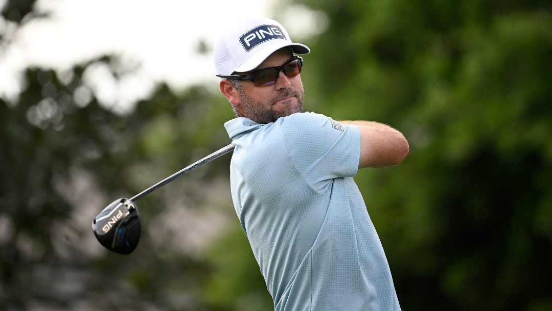 Corey Conners, of Canada, warms up before hitting his tee shot on the first hole during the final round of the Arnold Palmer Invitational at Bay Hill golf tournament, Sunday, March 9, 2025, in Orlando, Fla.