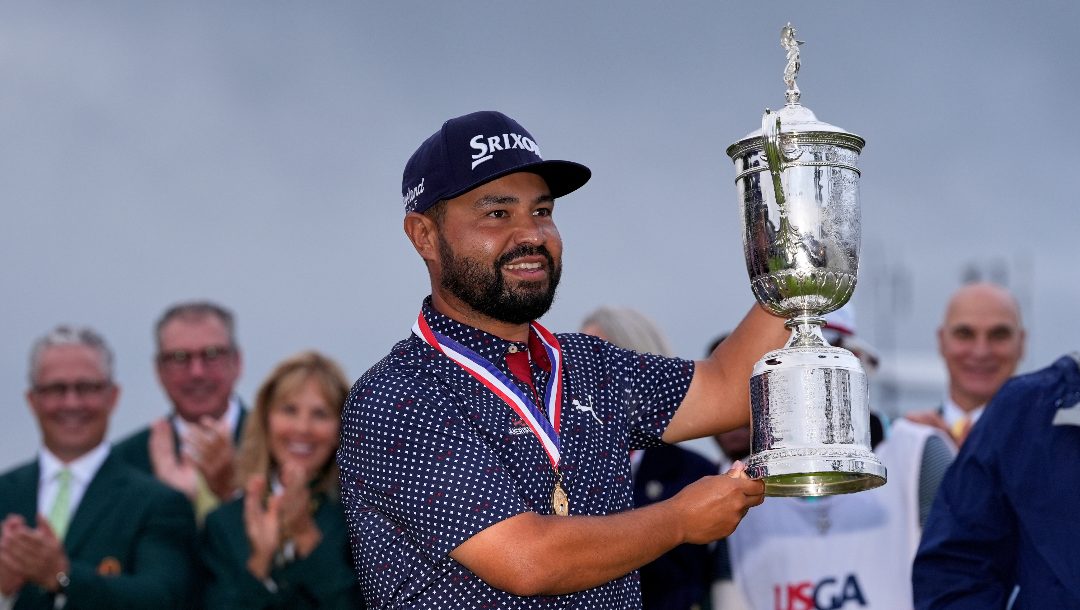 J.J. Spaun celebrates with the trophy after winning the U.S. Open golf tournament at Oakmont Country Club Sunday, June 15, 2025, in Oakmont, Pa.